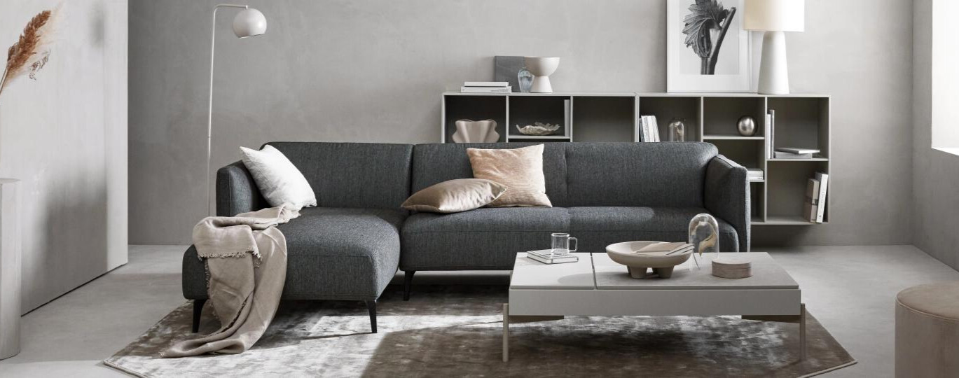 Grey sofa in a well lit room Grey sofa in a well lit room